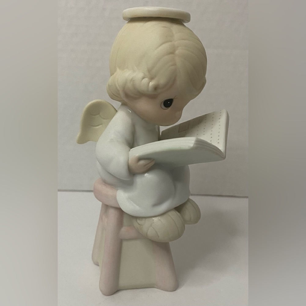 Precious Moments "Sitting Pretty" Angel sitting on a stool babysitting